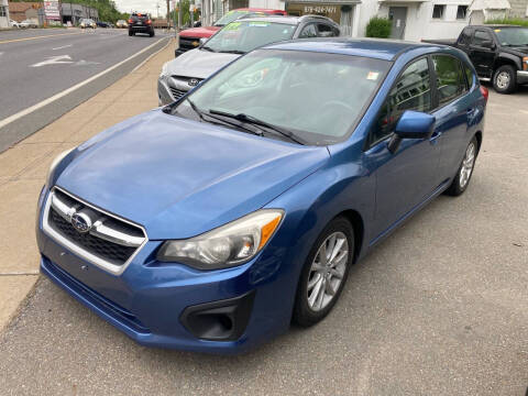 2014 Subaru Impreza for sale at Twin City Auto in Fitchburg MA