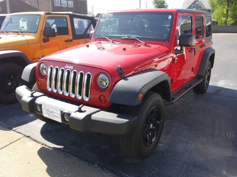 2011 Jeep Wrangler Unlimited for sale at Village Auto Outlet in Milan IL