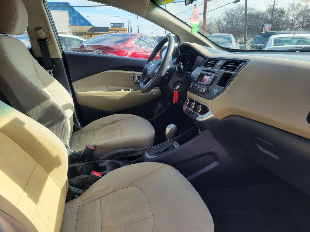 2015 Kia Rio for sale at DAGO'S AUTO SALES LLC in Dalton, GA