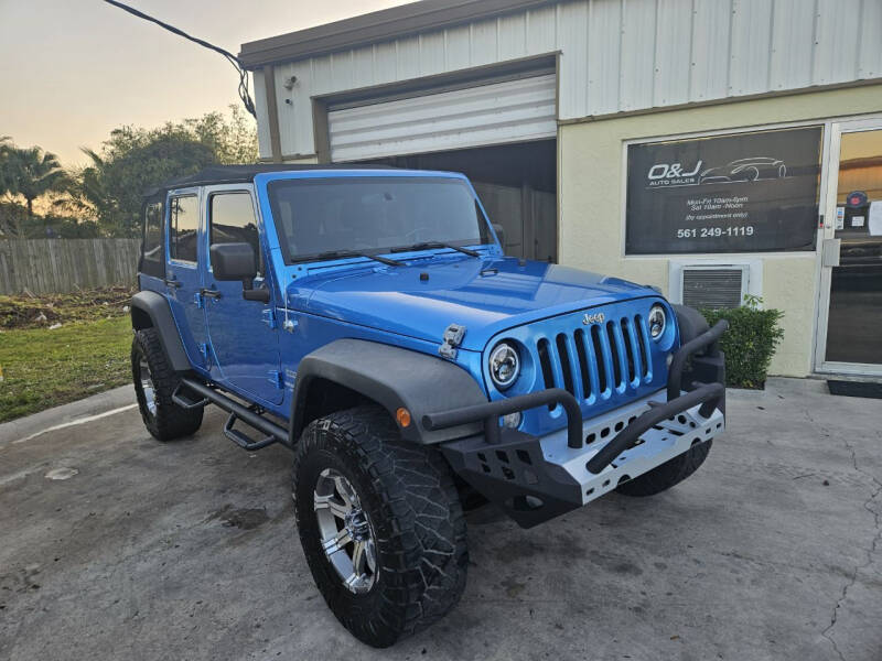 2010 Jeep Wrangler Unlimited for sale at O & J Auto Sales in Royal Palm Beach FL