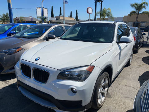 2015 BMW X1 for sale at UNIQUE AUTOMOTIVE GROUP in San Diego CA