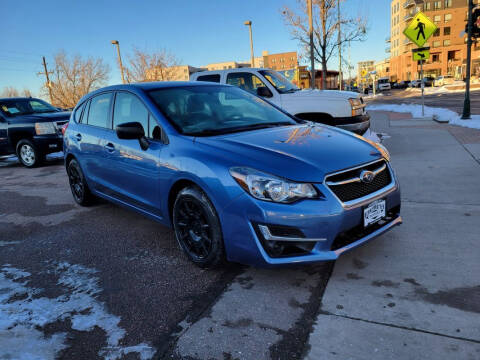 2016 Subaru Impreza for sale at BERKENKOTTER MOTORS in Brighton CO