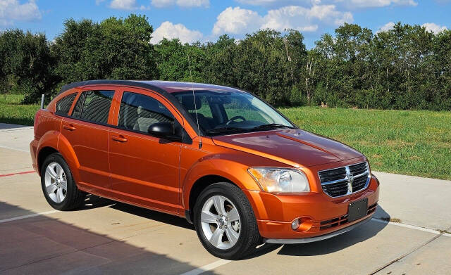 2011 Dodge Caliber for sale at CAR MARKET AUTO GROUP in Sugar Land, TX