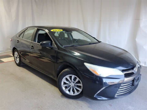 2016 Toyota Camry for sale at Tradewind Car Co in Muskegon MI