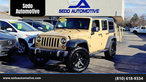 2014 Jeep Wrangler Unlimited for sale at Sedo Automotive in Davison MI