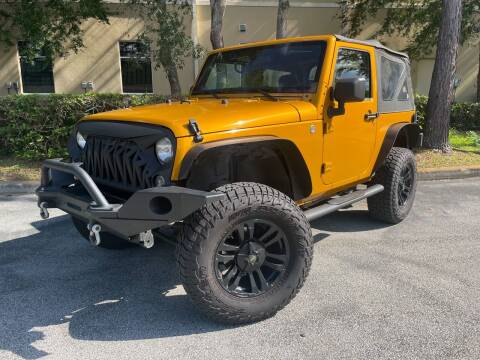 2014 Jeep Wrangler for sale at CARPORT SALES AND  LEASING in Oviedo FL