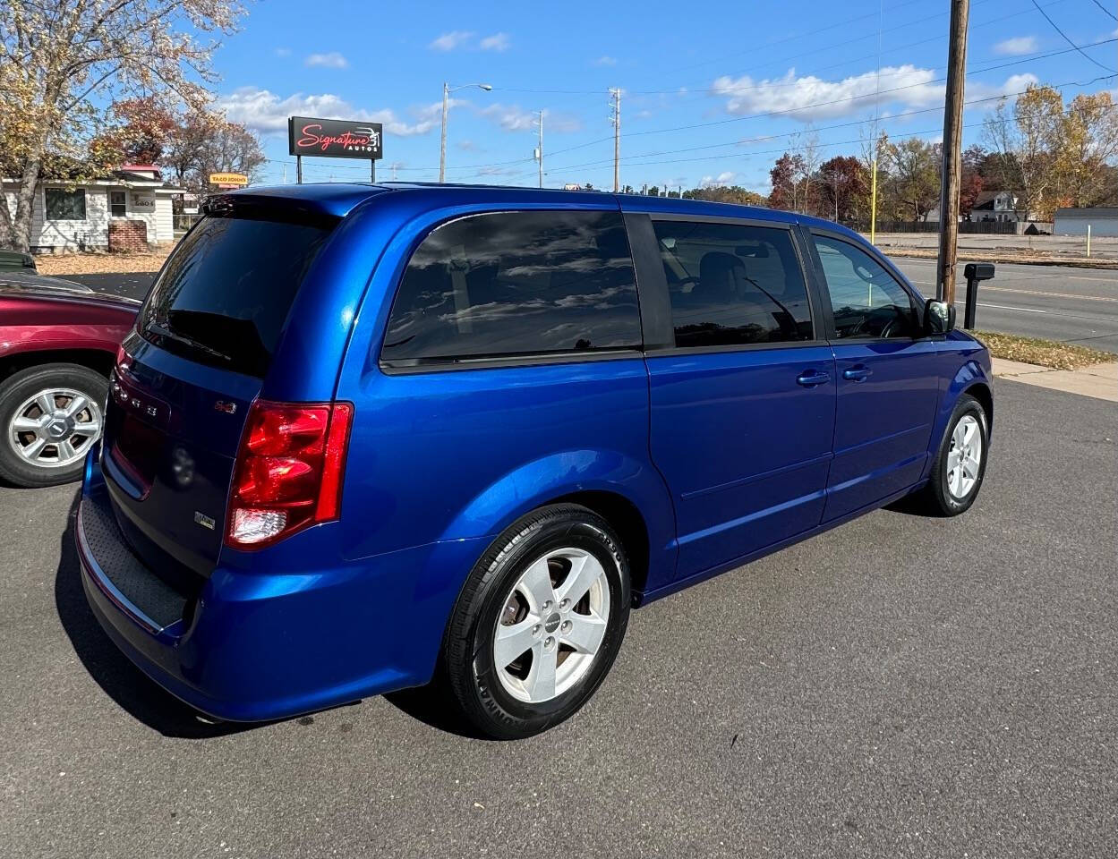 2013 Dodge Grand Caravan for sale at SIGNATURE AUTOS LLC in Weston, WI