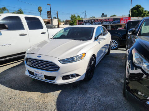 2015 Ford Fusion Hybrid for sale at E and M Auto Sales in Bloomington CA