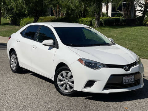 2015 Toyota Corolla for sale at MILLENNIUM MOTORS in Van Nuys CA