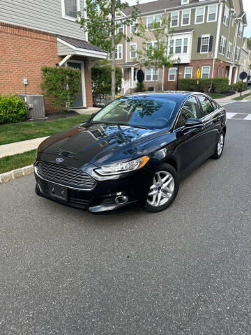 2014 Ford Fusion for sale at CarsHut in Lodi NJ