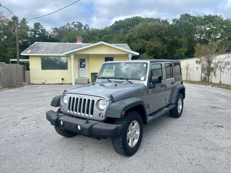 2014 Jeep Wrangler Unlimited for sale at Louie's Auto Sales in Leesburg FL