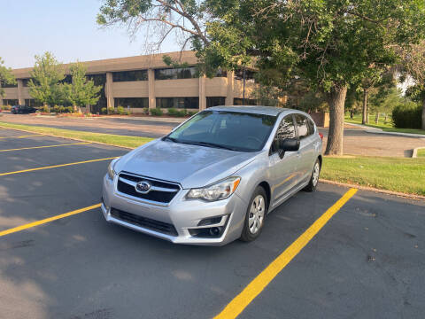 2014 Subaru Impreza for sale at QUEST MOTORS in Englewood CO