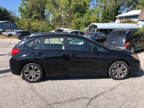 2013 Subaru Impreza for sale at BELL AUTO & TRUCK SALES in Fort Wayne IN