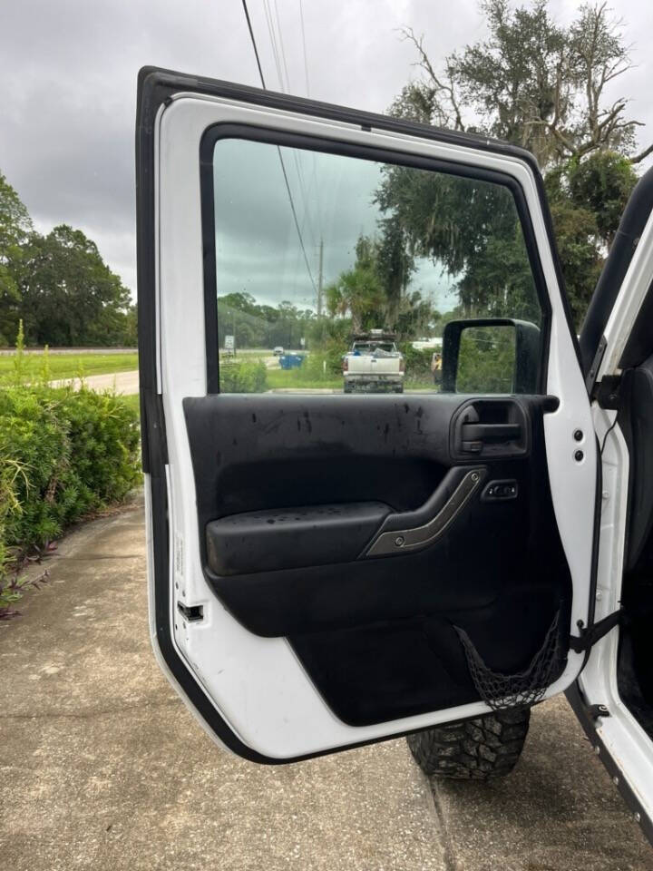 2013 Jeep Wrangler Unlimited for sale at Putnam Motors in Pomona Park, FL