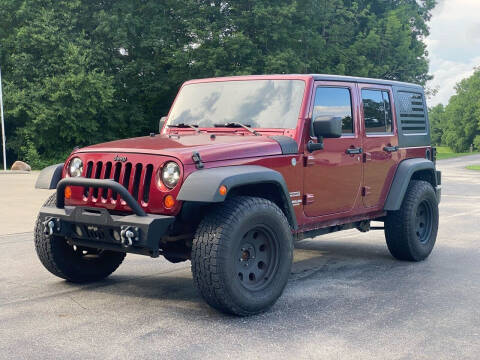 2011 Jeep Wrangler Unlimited for sale at CMC AUTOMOTIVE in Urbana IN