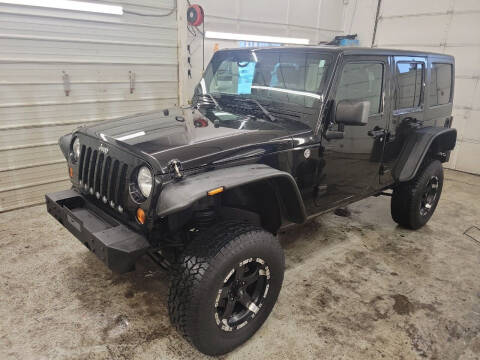 2012 Jeep Wrangler Unlimited for sale at Jem Auto Sales in Anoka MN