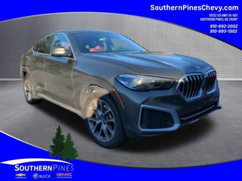 2022 BMW X6 for sale at PHIL SMITH AUTOMOTIVE GROUP - SOUTHERN PINES GM in Southern Pines NC