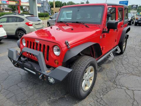 2011 Jeep Wrangler Unlimited for sale at Signature Auto Group in Massillon OH
