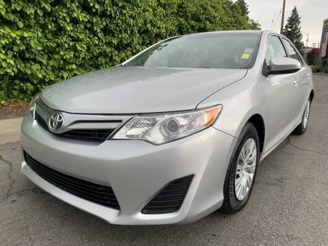 2014 Toyota Camry for sale at PREMIER AUTO GROUP in San Jose CA