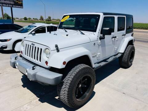2013 Jeep Wrangler Unlimited for sale at A AND A AUTO SALES in Gadsden AZ