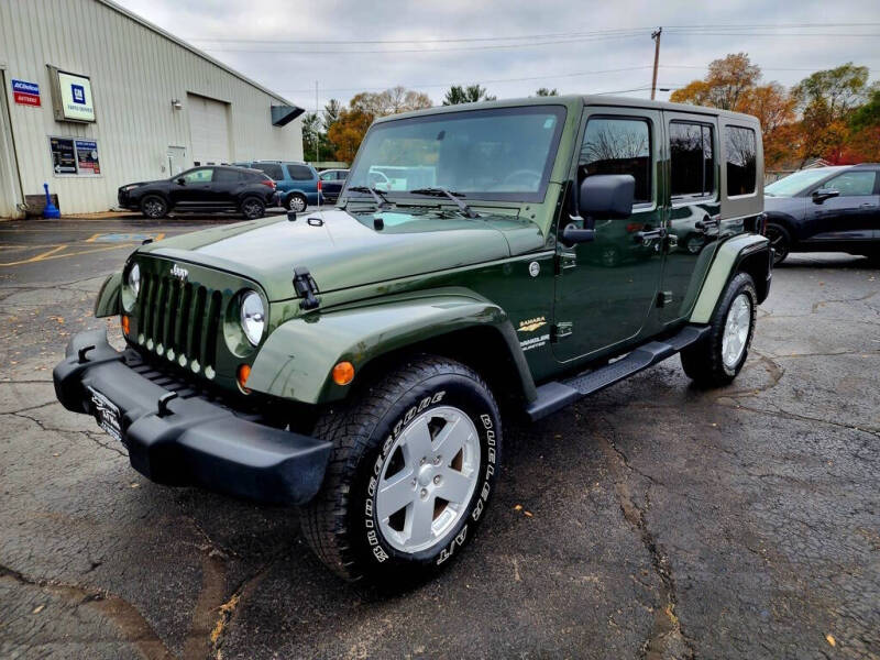 Used 2007 Jeep Wrangler Unlimited Sahara with VIN 1J4GA591X7L120038 for sale in Adams, WI