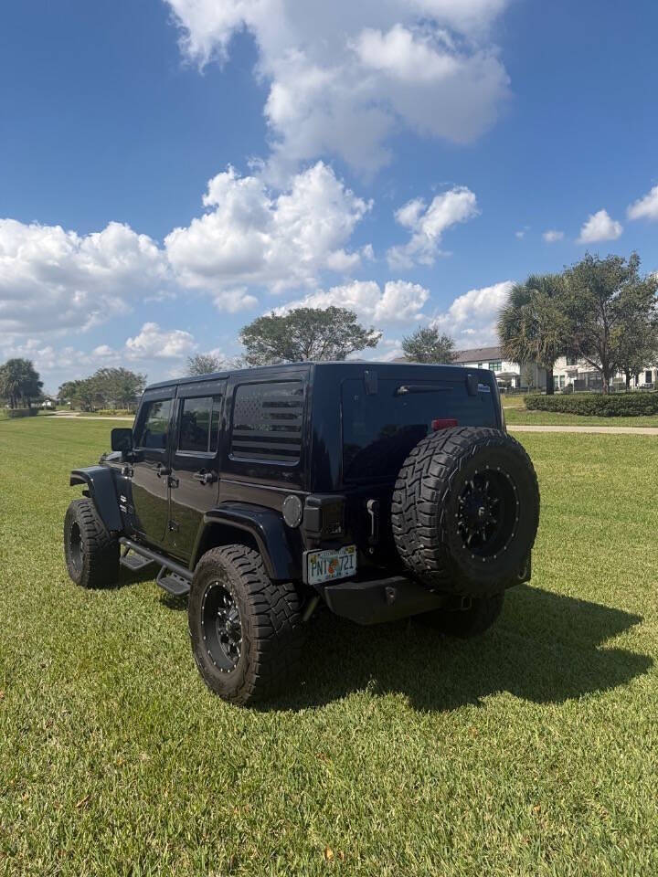 2014 Jeep Wrangler Unlimited Sahara 4x4 4dr SUV - Black Clear Coat exterior view 11
