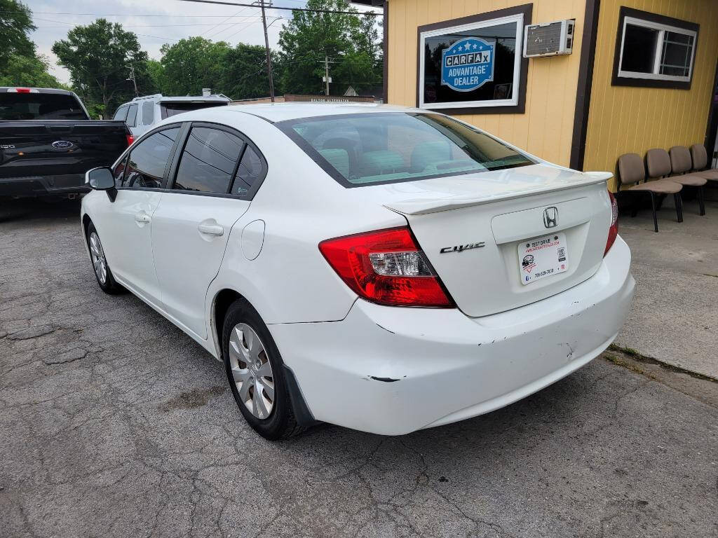 2012 Honda Civic for sale at DAGO'S AUTO SALES LLC in Dalton, GA