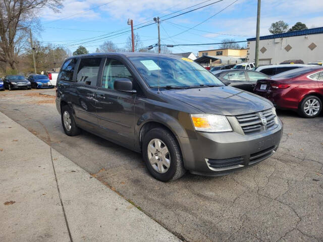 2010 Dodge Grand Caravan for sale at DAGO'S AUTO SALES LLC in Dalton, GA