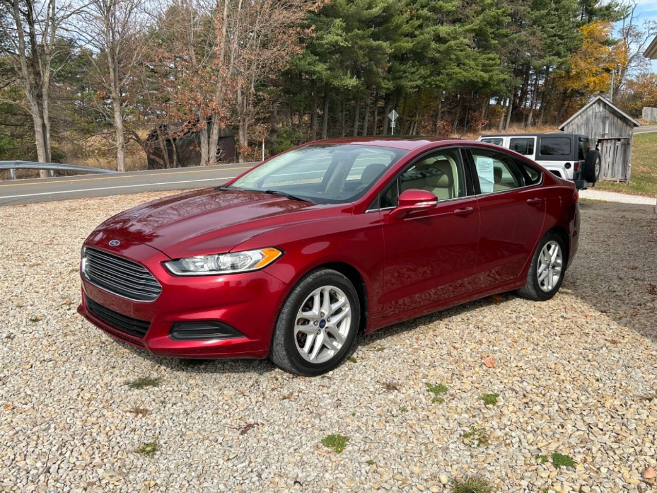 2014 Ford Fusion for sale at STRODES AUTO GROUP LLP in Malta, OH