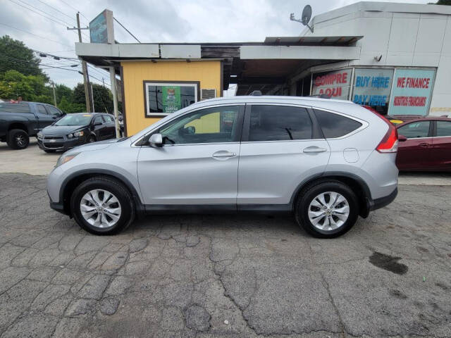 2014 Honda CR-V for sale at DAGO'S AUTO SALES LLC in Dalton, GA