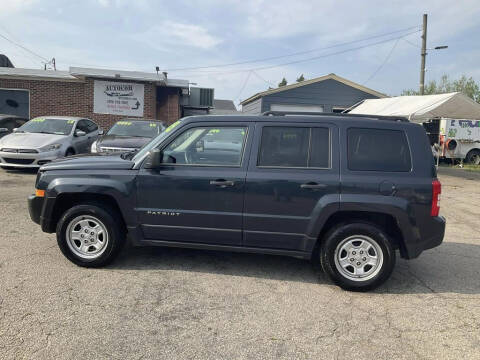 2015 Jeep Patriot for sale at Autocom, LLC in Clayton NC