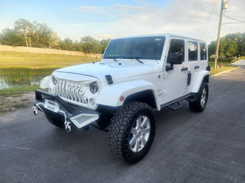 2013 Jeep Wrangler Unlimited for sale at Carcoin Auto Sales in Orlando FL