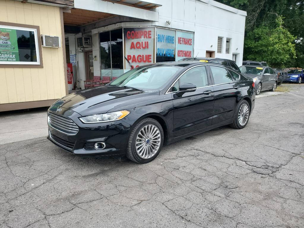 2016 Ford Fusion for sale at DAGO'S AUTO SALES LLC in Dalton, GA