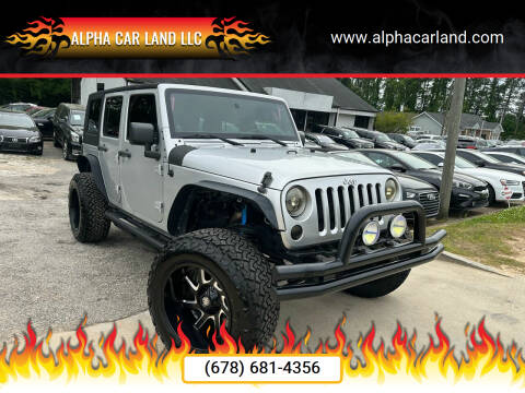 2012 Jeep Wrangler Unlimited for sale at Alpha Car Land LLC in Snellville GA