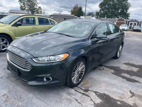 2016 Ford Fusion for sale at HEDGES USED CARS in Carleton MI