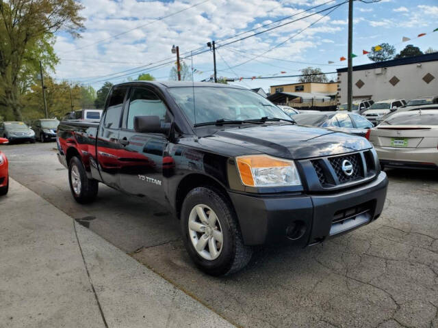 2011 Nissan Titan for sale at DAGO'S AUTO SALES LLC in Dalton, GA