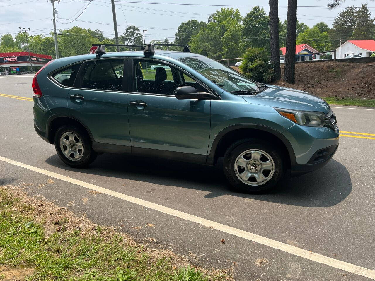 Preowned 2014 HONDA CR-V LX AWD 4dr SUV for sale by The Auto Finders Car Dealership of Durham in Durham, NC