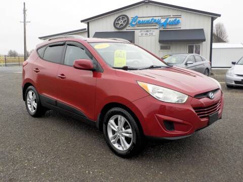 2011 Hyundai Tucson for sale at Country Auto in Huntsville OH