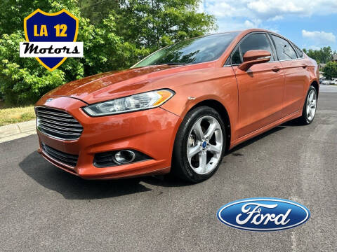 2014 Ford Fusion for sale at LA 12 Motors in Durham NC