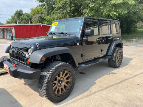 2011 Jeep Wrangler Unlimited for sale at Azteca Auto Sales LLC in Des Moines IA