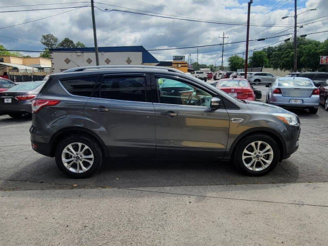 2014 Ford Escape for sale at DAGO'S AUTO SALES LLC in Dalton, GA