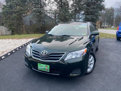 2011 Toyota Camry for sale at DISTINCT AUTO GROUP LLC in Kent OH