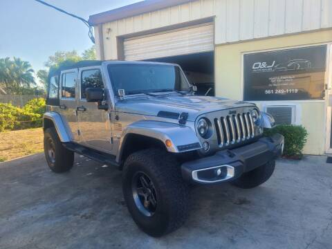 2013 Jeep Wrangler Unlimited for sale at O & J Auto Sales in Royal Palm Beach FL