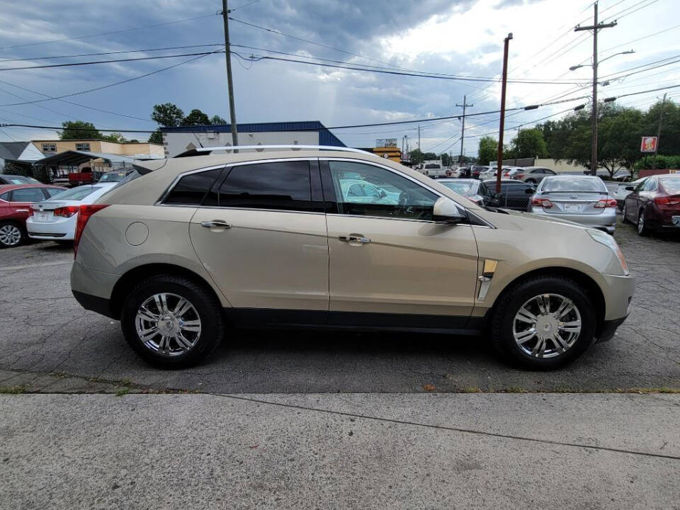 2011 Cadillac SRX for sale at DAGO'S AUTO SALES LLC in Dalton, GA