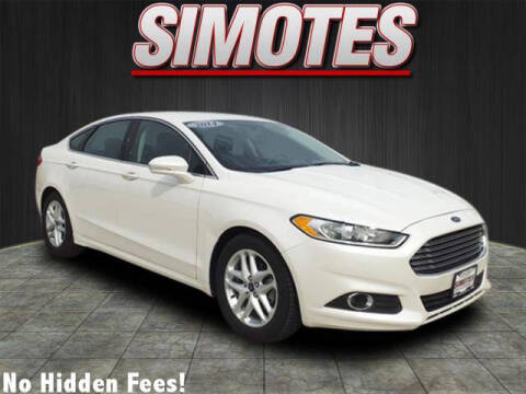 2014 Ford Fusion for sale at SIMOTES MOTORS in Minooka IL