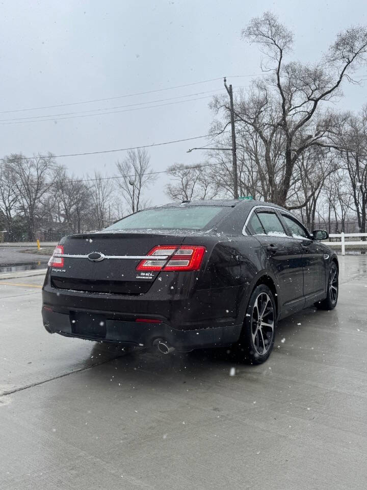 2014 Ford Taurus for sale at H & H AUTO GROUP in Detroit, MI