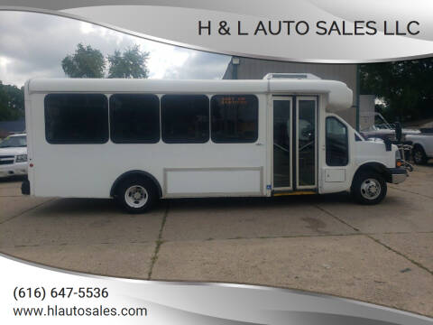 2013 Chevrolet Express for sale at H & L AUTO SALES LLC in Wyoming MI