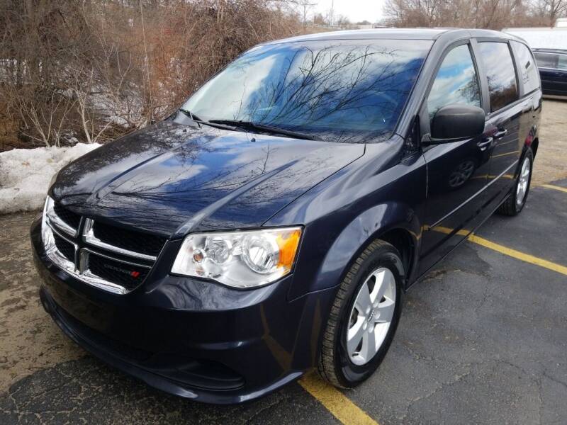 2013 Dodge Grand Caravan for sale at Howe's Auto Sales in Lowell MA