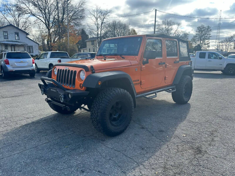 2012 Jeep Wrangler Unlimited for sale at Rombaugh's Auto Sales in Battle Creek MI