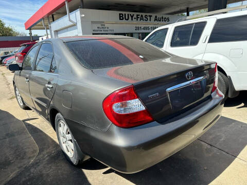 2003 Toyota Camry for sale at Buy-Fast Autos in Houston TX